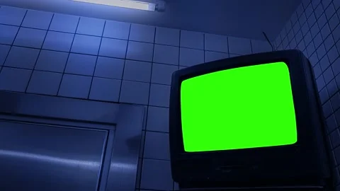Green Screen TV Hanging Up Inside Dark Room Video stock 159595011