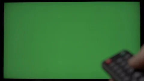 Green screen TV for replacing images with a hand and remote control Stock Footage 102665745