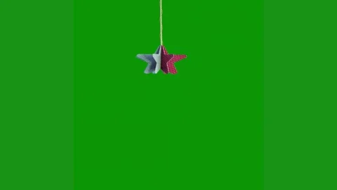 Green screen white background toy hanging string from ceiling christmas star red Stock Footage 314064863