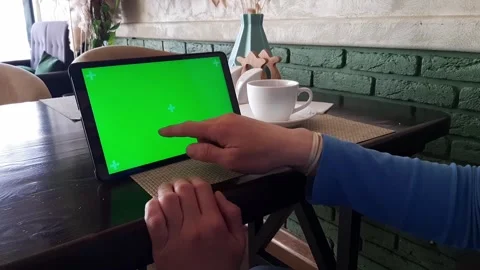 Green screened - track marked close up tablet pc is used by a woman hand Stock Footage 165713082