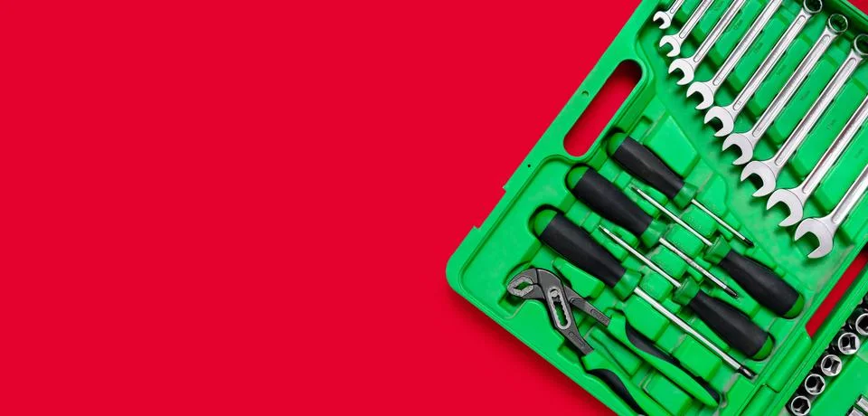 Green set of construction tools: wrenches, adjustable pliers, screwdrivers an Stock Photos