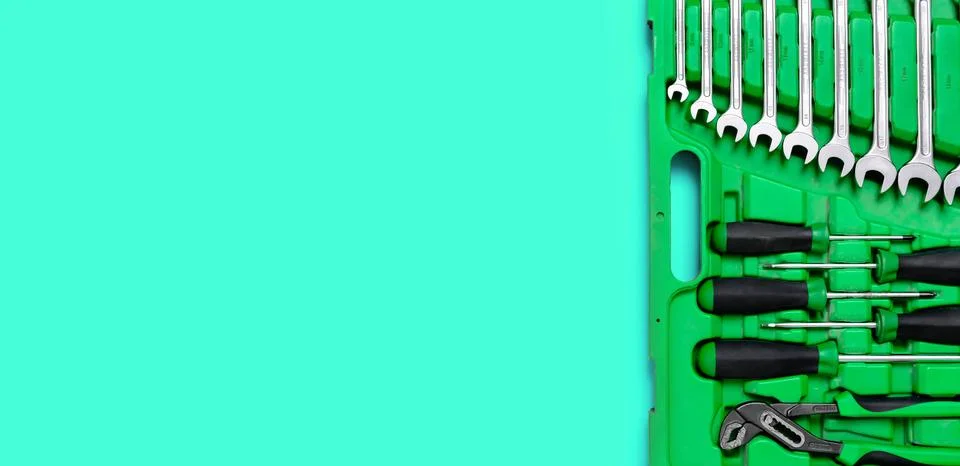 Green set of construction tools: wrenches, adjustable pliers, screwdriver and so Stock Photos