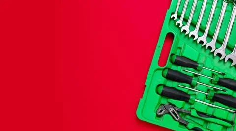 Green set of construction tools: wrenches, adjustable pliers, screwdriver and so Stock Photos