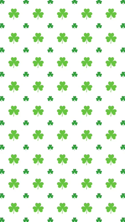 Green shamrock pattern background loop for St. Patrick's Day decoration. Stock Footage 328632864