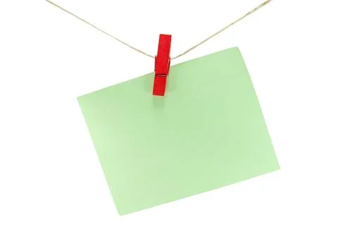 Green sheet of paper for notes and paperclip isolate on white Foto stock
