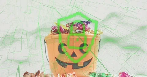 Green shield appearing at pumpkin bucket, launching candy scan causing wrappers Stock Footage 317772697