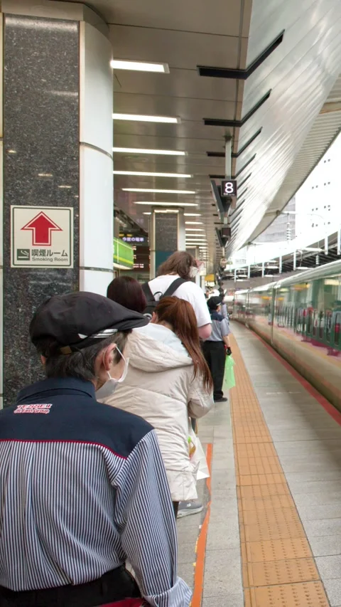 Green Shinkansen Bullet Train Arriving at Tokyo Station Platform Stock Footage 334920784