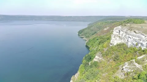 Green slopes along the water surface Bakota Ukraine. Stock Footage 313954077