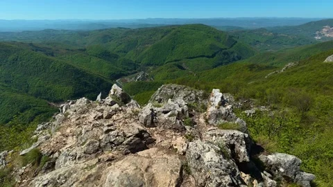Green slopes roll endlessly beneath a clear. Ovcar Kalbar Gorge, Serbia Видео 333842213