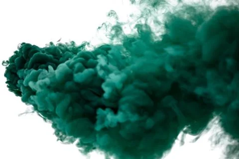 Green smoke bomb exploding against white background Stock Photos