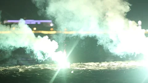 Green smoke bombs exploding on the beach Stock Footage 133025836