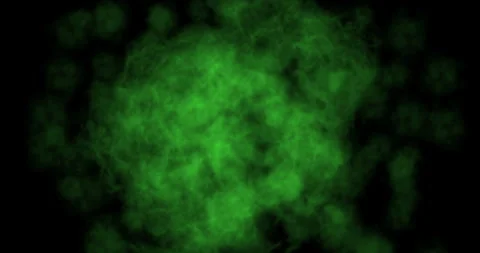 Green smoke explosion slowly floating through space against black background Stock Footage 289556892