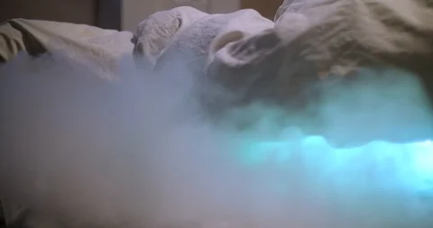 Green smoke from under the blankets Stock Footage 88060684