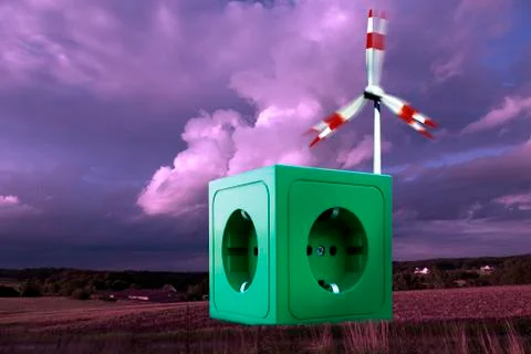 Green socket on landscape in front of windmill Stock Photos