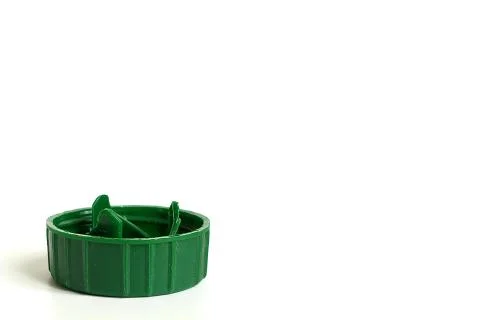 Green soft drink bottle cap on white background Stock Photos