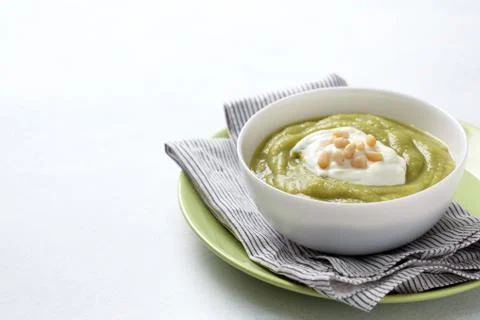 Green soup with pine nuts Stock Photos