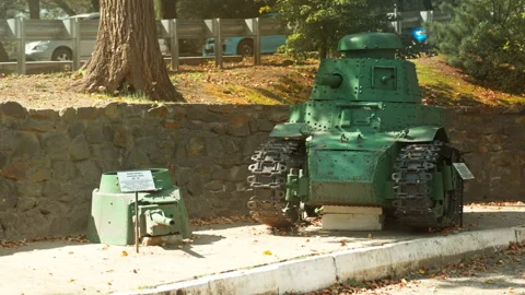 A green Soviet tank stands in the middle of the street. Wartime. World War II Stock-Footage 346329063