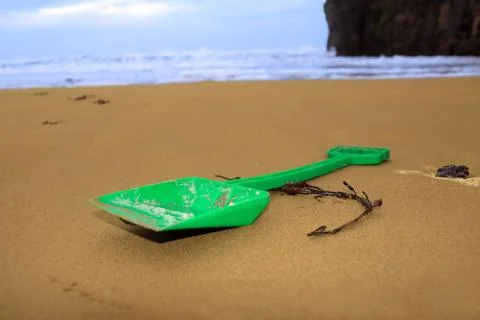 Green spade on beach Stock Photos