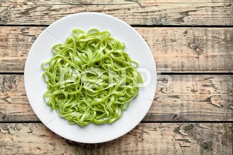 Green spaghetti pasta halloween vegetarian food holiday decoration kid party Stock Photos