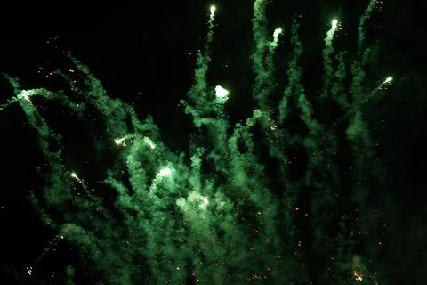 Green Sparkle In Night Background Stock Photos