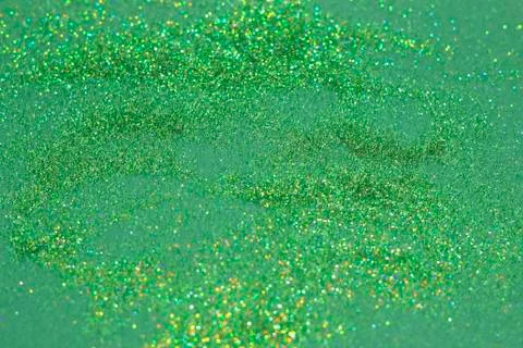 The green sparkles and glitter on a deep green background Stock Photos