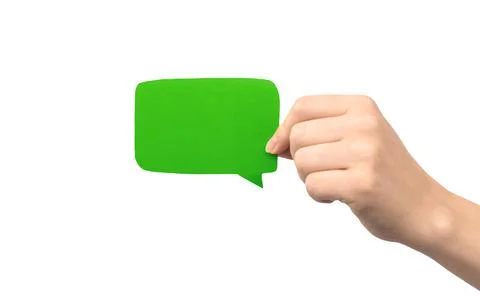 Green speech bubble in hand isolated on a white background. Giving feedback,  Foto stock