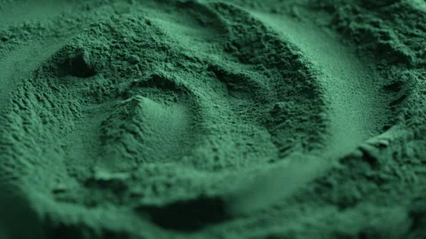 Green spirulina algae powder, rotation. Dietary supplement to improve health Stock Footage 301552987