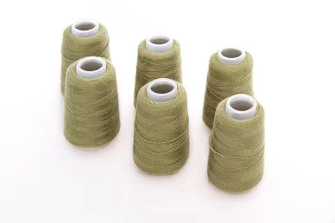Green spool of thread isolated on white background. Skein of woolen threads Stock Photos