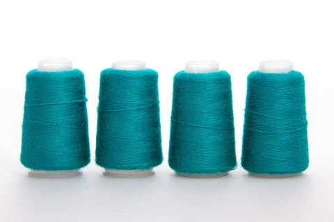 Green spool of thread isolated on white background. Skein of woolen threads Stock Photos