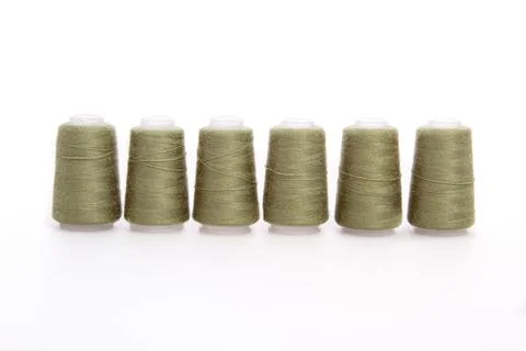 Green spool of thread isolated on white background. Skein of woolen threads Stock Photos