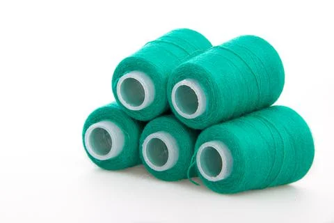 Green spool of thread isolated on white background. Skein of woolen threads Stock Photos