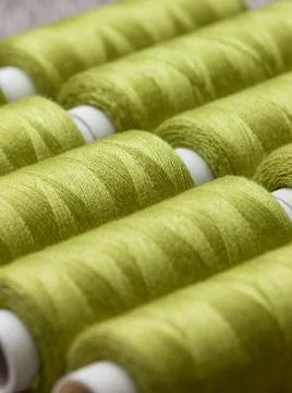 Green spools of thread Stock Photos