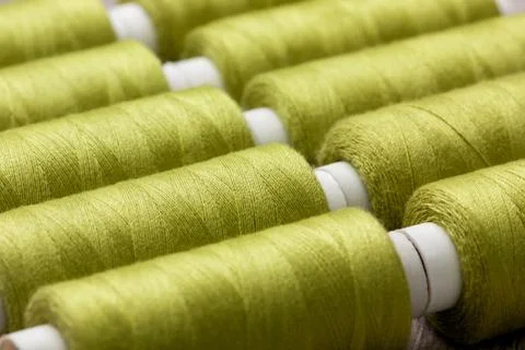 Green spools of thread Stock Photos