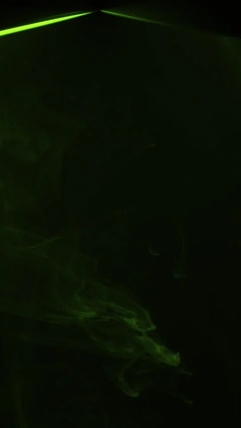 Green Spotlight atmospheric on black Background Vertical Video Stock Footage 340390705