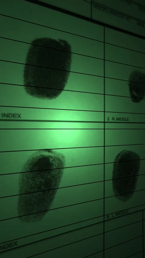 Green spotlight scans over multi fingerprint identification files Stock Footage 318067298