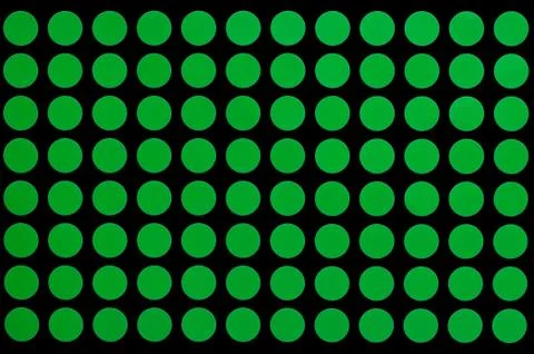 Green spots on black background. Stock Illustration