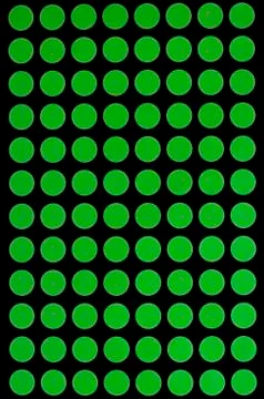 Green spots on black background. Stock Illustration