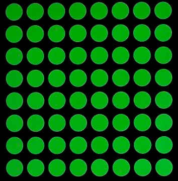 Green spots on black background. Stock Illustration