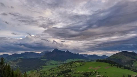 Green spring blooming landscape after rain. Grassy pastures in a hilly landscape Stock-Footage 167974724