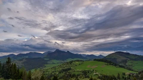 Green spring blooming landscape after rain. Grassy pastures in a hilly landscape Stock Footage 167974802