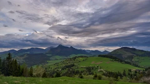 Green spring blooming landscape after rain. Grassy pastures in a hilly landscape Stock Footage 167974880