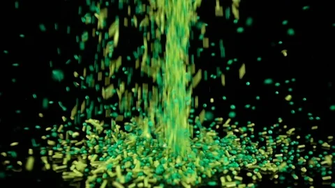 Green Sprinkles falling in slow motion. 库存影片 88615709