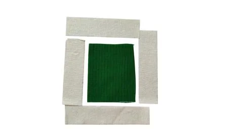 Green square framed by light beige paper edges Stock Photos