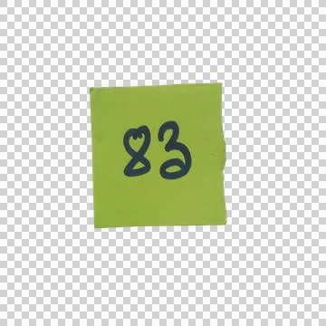 Green square paper note with the number eighty three written in black marke.. Фото