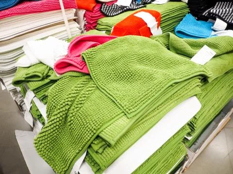 Green Stack of bath towels on light in store closeup Stock Photos