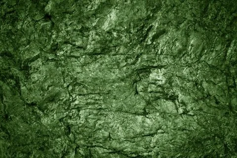 Green stone background. Rock surface. Mountain texture. Stock Photos