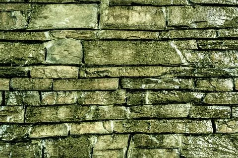 Green stone masonry texture forms rustic yet elegant background. intricate de Stock Photos