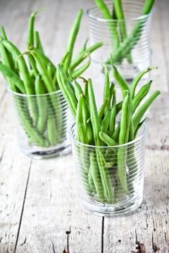 Green string beans in glasses Stock Photos