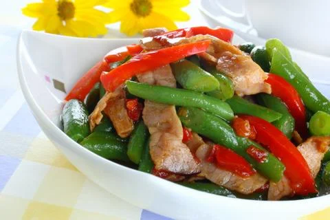 Green string beans with ham and paprika Stock Photos