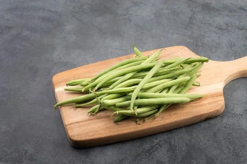 Green string beans on a  textured background, empty space for text, vegetable 스톡 사진
